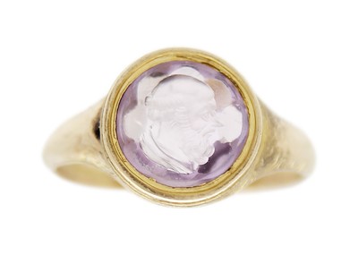 Lot 25 - A 19th century gold amethyst intaglio signet ring.