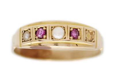 Lot 28 - A Victorian gold ruby and seed pearl band ring.