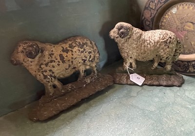 Lot 69 - Two Victorian cast iron ram door stops.