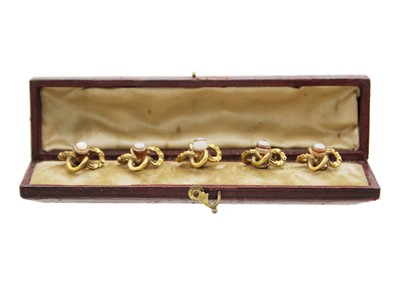 Lot 26 - A set of five pinchbeck, banded agate set buttons, within original box.