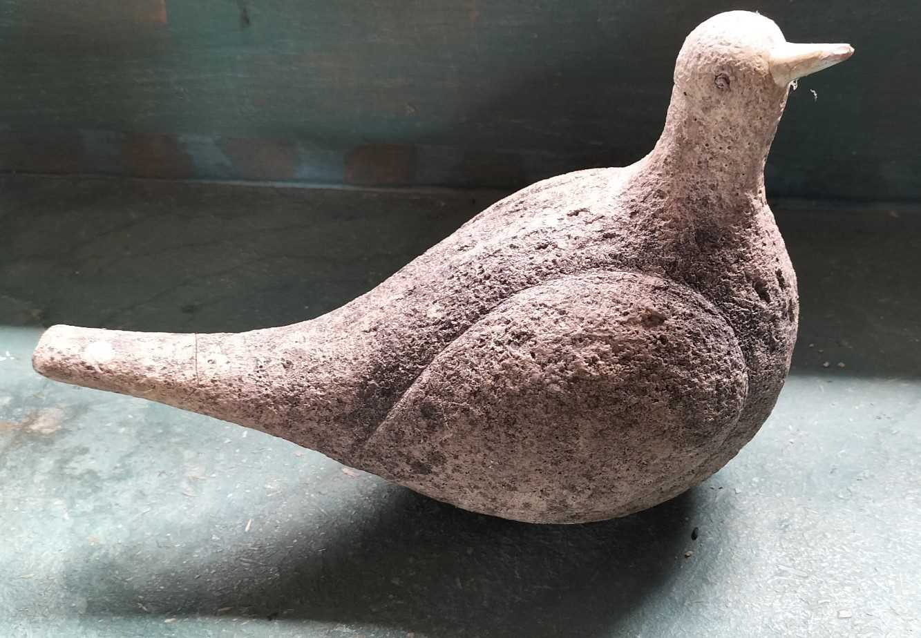 Lot 71 - A reconstituted stone figure of a pigeon.
