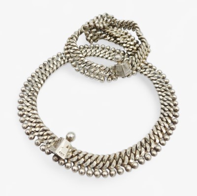 Lot 129 - A pair of Indian silver anklets.