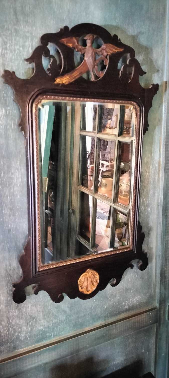 Lot 73 - A George III style mahogany and gilt wall mirror.