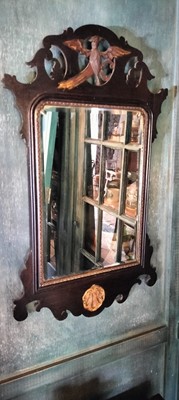 Lot 73 - A George III style mahogany and gilt wall mirror.