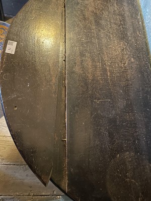 Lot 75 - A George II oak fold top half round tea table.
