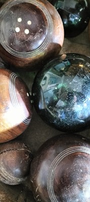 Lot 76 - A group of five lignum bowling woods.