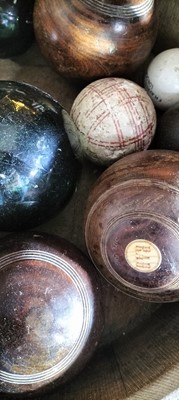 Lot 76 - A group of five lignum bowling woods.