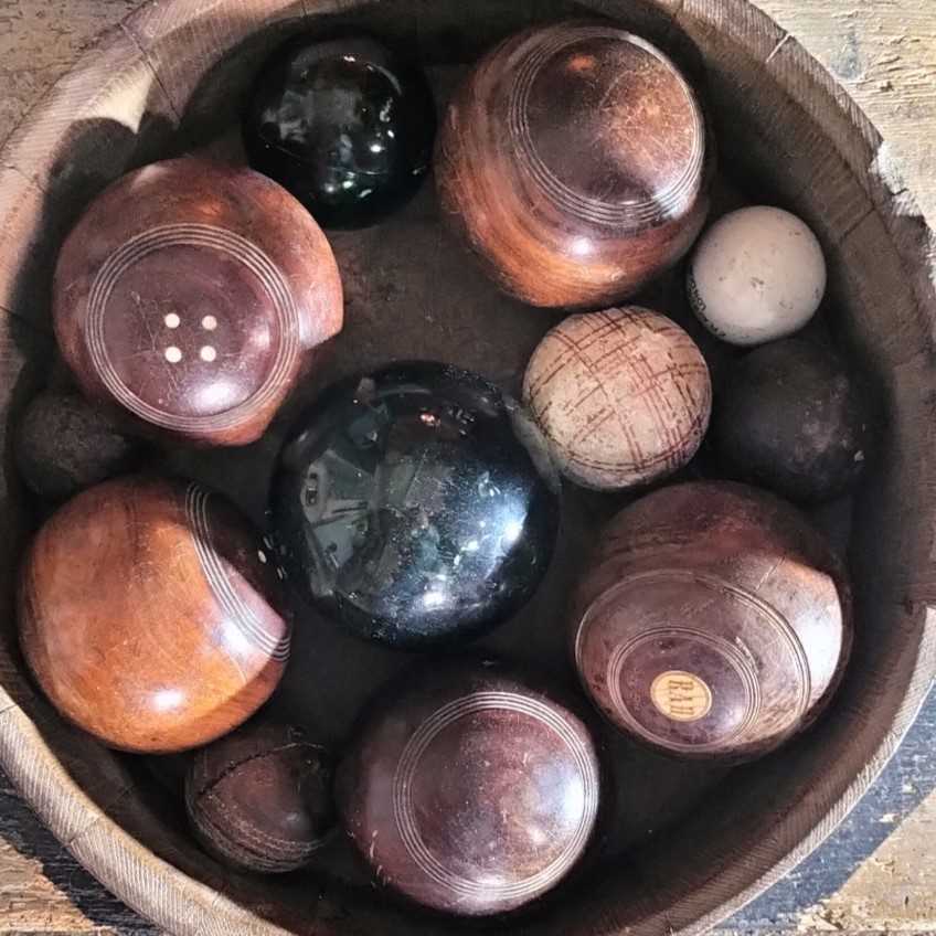 Lot 76 - A group of five lignum bowling woods.