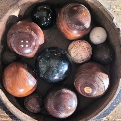 Lot 76 - A group of five lignum bowling woods.