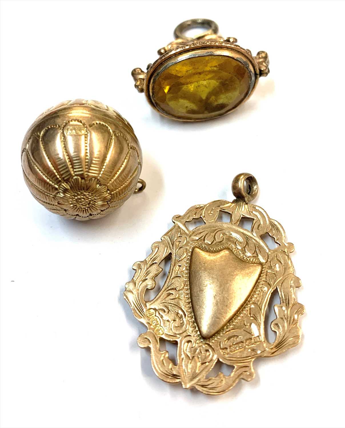 Lot 2511 - A 9ct gold pomander, a 9ct gold chased prize...