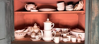 Lot 81 - A shelf of predominantly white glazed china.