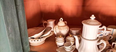 Lot 81 - A shelf of predominantly white glazed china.