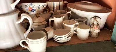 Lot 81 - A shelf of predominantly white glazed china.