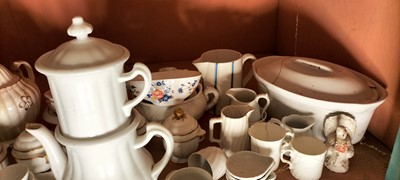 Lot 81 - A shelf of predominantly white glazed china.