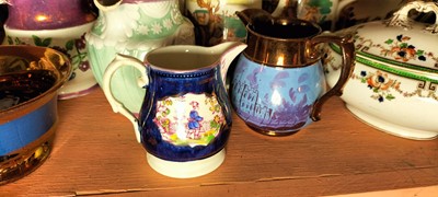 Lot 82 - A shelf of predominantly Victorian pottery jugs.