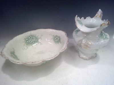 Lot 122 - A floral wash bowl and jug. The Jug is 31cm tall.