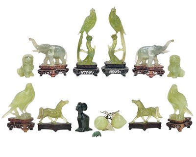 Lot 576 - A pair of Chinese jade type dogs of fo.