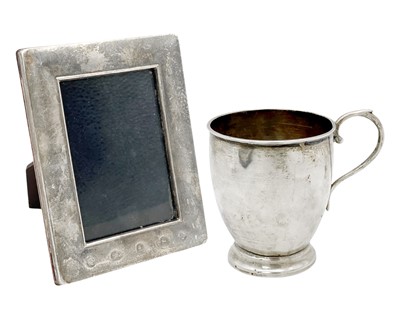 Lot 129 - A white metal (tests as silver) pedestal cup, and a modern silver-mounted photograph frame.