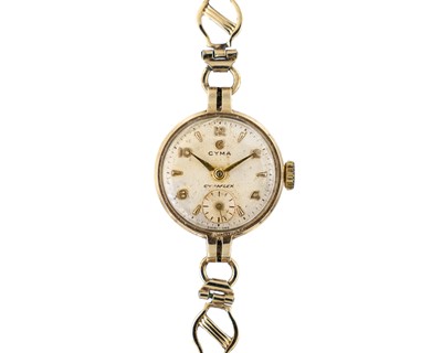 Lot 229 - CYMA - A Cymaflex 9k gold ladies' manual wind wristwatch on 9k gold bracelet.