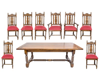 Lot 927 - An oak refectory table and eight chairs.