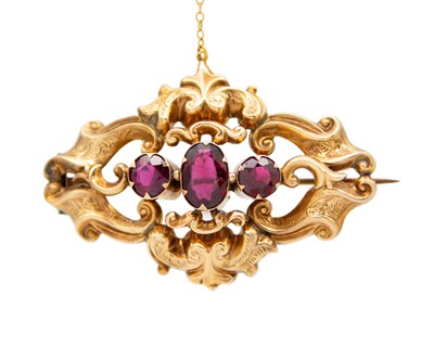 Lot 62 - A Victorian gold and almandine garnet brooch.