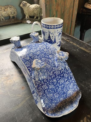 Lot 94 - A Staffordshire blue and white pottery cheese coaster.