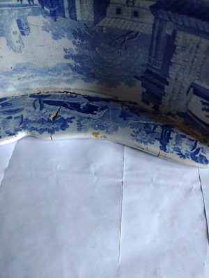 Lot 94 - A Staffordshire blue and white pottery cheese coaster.