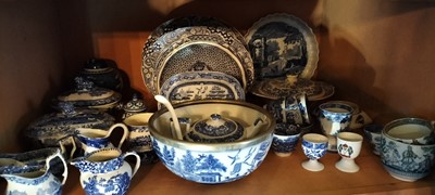 Lot 95 - Two shelves of mainly blue and white pottery.