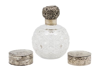 Lot 142 - Two similar 19th-century Dutch 800 silver hinged pill boxes, and a scent bottle.