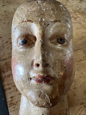 Lot 99 - A carved and gesso head of a saint.