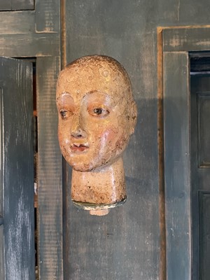Lot A carved and gesso head of a saint.