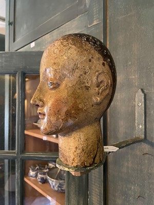 Lot A carved and gesso head of a saint.