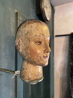 Lot A carved and gesso head of a saint.