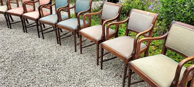Lot 105 - A set of eight mahogany elbow chairs.