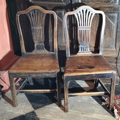 Lot 107 - A pair of elm country "Chippendale' style dining chairs.