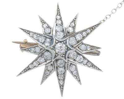 Lot 60 - A Victorian gold and diamond starburst brooch.