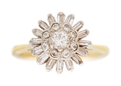 Lot An 18k gold and diamond set cluster ring.