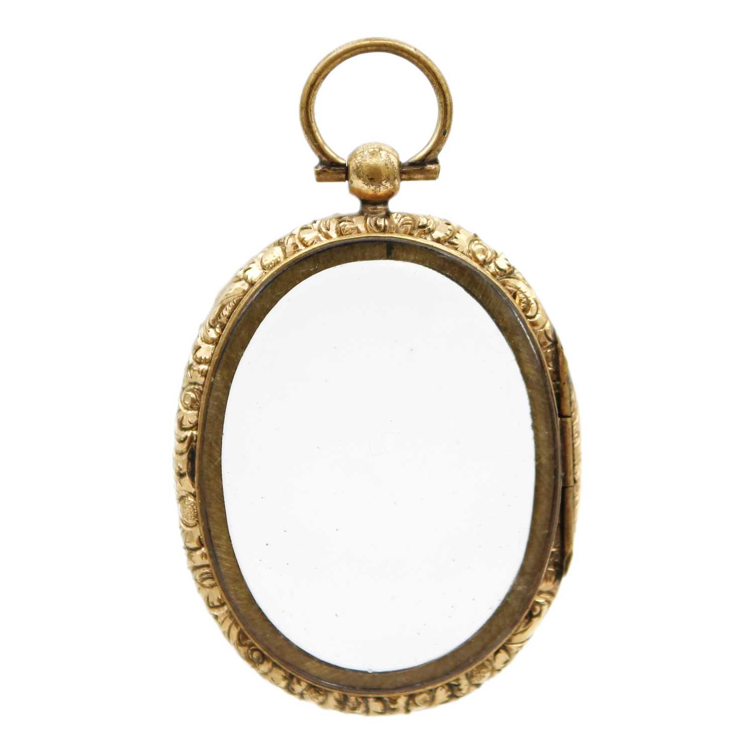 Lot 51 - A Victorian gold-plated double-sided locket.