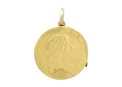 Lot 112 - An unusual 19th-century 22k gold George III spade guinea and a Charles II guinea coin locket pendant.