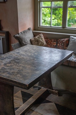 Lot 116 - A stained beech extending dining table.