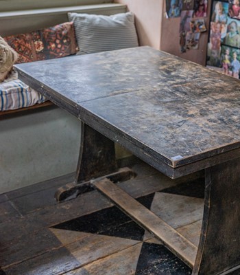 Lot 116 - A stained beech extending dining table.