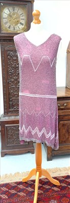 Lot 3016 - A 1920s pink and silver beaded flapper dress,...