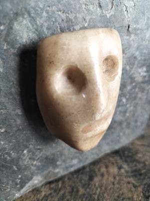 Lot 123 - A white marble face.