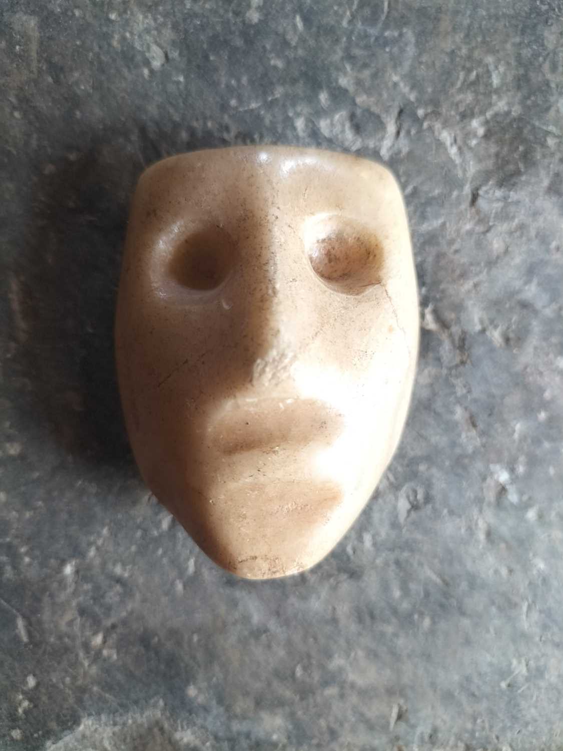 Lot 123 - A white marble face.