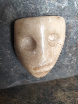 Lot 123 - A white marble face.