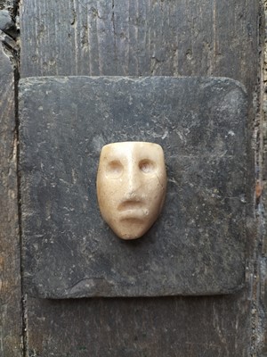 Lot 123 - A white marble face.