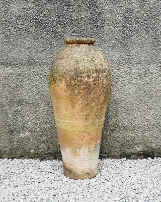 Lot 776 - A large weathered terracotta olive oil jar.