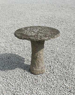 Lot 758 - A carved granite garden table with circular top.