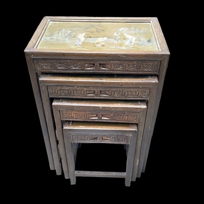 Lot 62 - A set of four nesting Chinese tables, the...