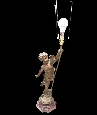 Lot 49 - A 19th-century spelter cherub table lamp with...